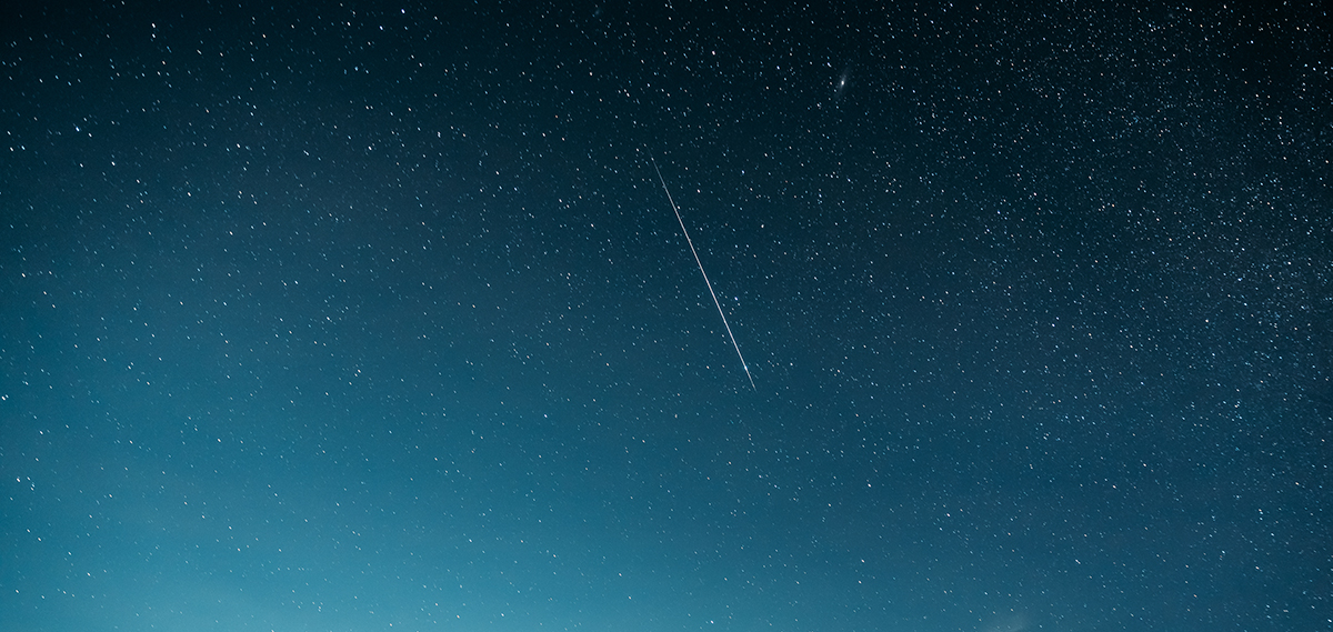 The Perseid Meteor Shower Near Yellowstone: Your Complete 2026 Guide 3 A close up of the Milky Way galaxy with a single meteor streak cutting through the stars at a Bortle Class 1 sky in Wyoming