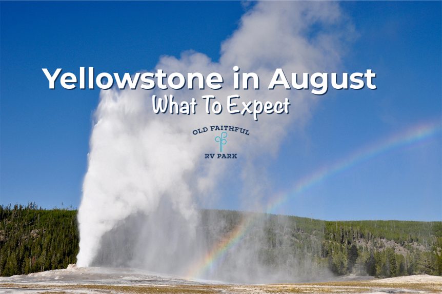 Old Faithful geyser erupting with a rainbow in the sky during a summer visit to Yellowstone in August