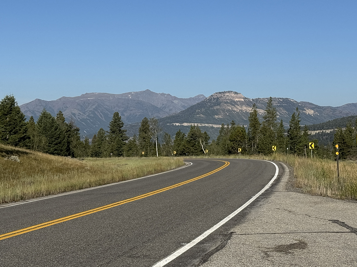 Beartooth Highway: The Complete Guide to One of America's Most Scenic Drives 4 Winding two lane road with switchback warning signs along the Beartooth Highway