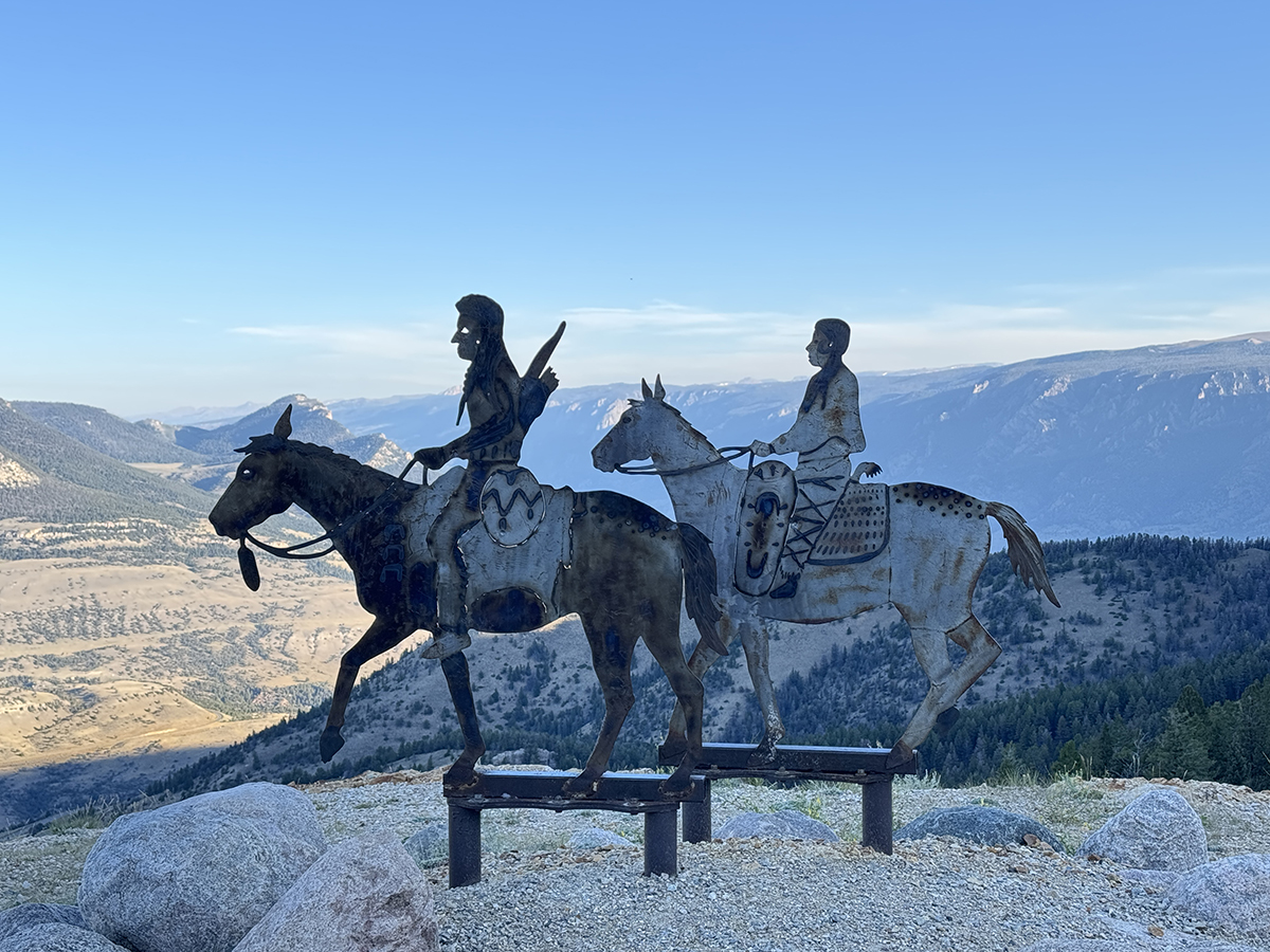 Beartooth Highway: The Complete Guide to One of America's Most Scenic Drives 6 Metal sculpture of two riders on horseback overlooking a mountain valley along Chief Joseph Scenic Byway
