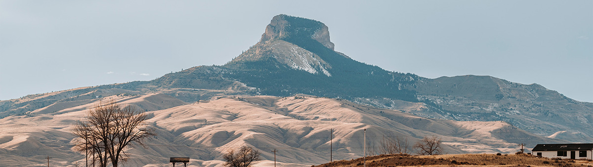 Heart Mountain peak near Cody Wyoming rising above rolling hills