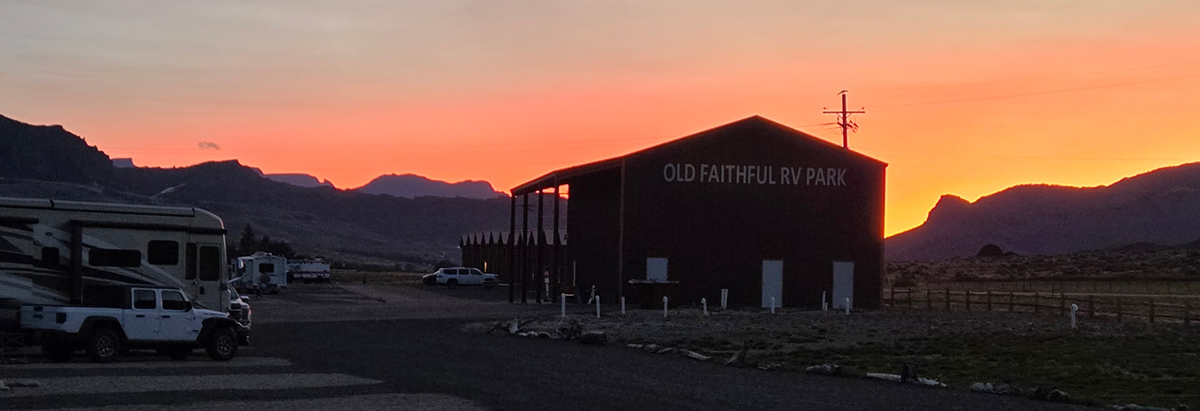 Still Time This Season: Why Now Is a Great Time for a Late Season Yellowstone Trip 2 Sunset over Old Faithful RV Park with RVs parked and mountains in the background