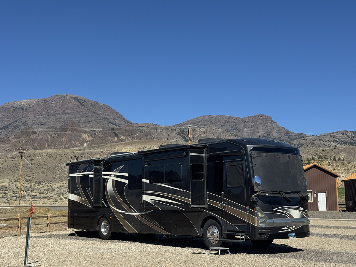 Thank You for an Amazing 2026 Season at Old Faithful RV Park 5 Large motorhome parked at Old Faithful RV Park with mountain views in the background