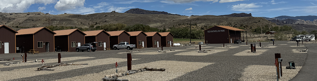 Still Time This Season: Why Now Is a Great Time for a Late Season Yellowstone Trip 4 Row of cabins with mountain views at Old Faithful RV Park during the Yellowstone shoulder season